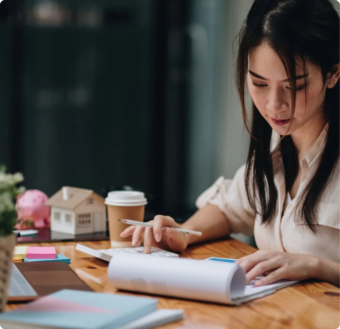 Client reviewing mortgage loan calculations and home financing options with guidance from Mamba Capital Lending mortgage broker services.