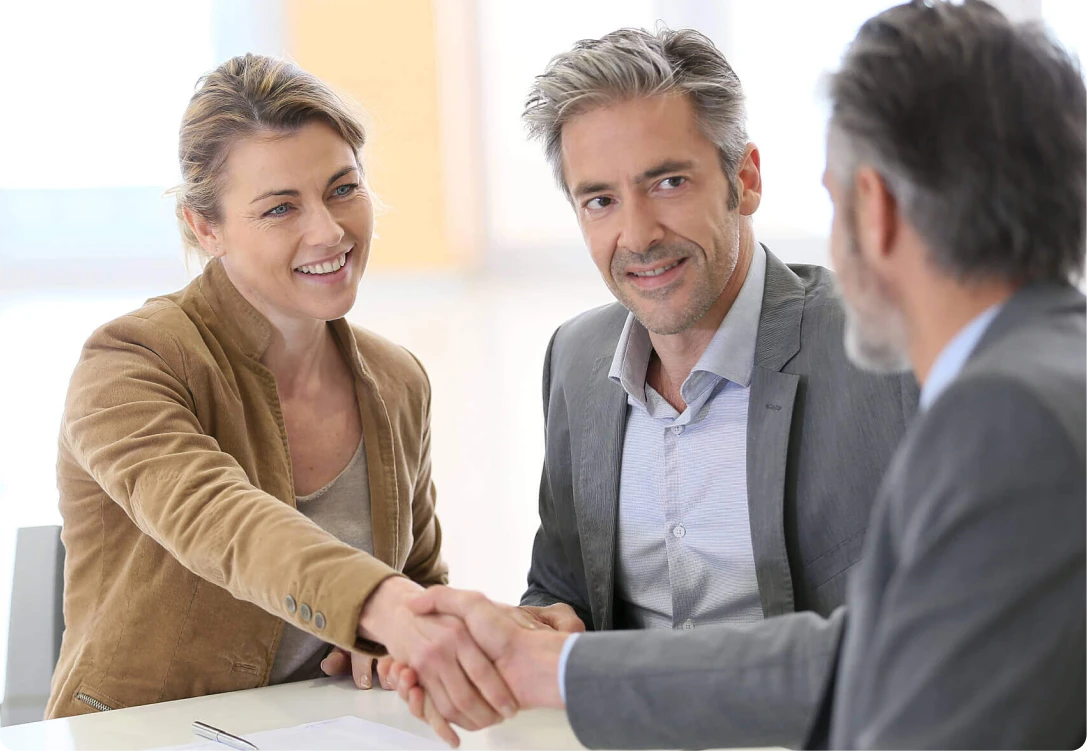 Clients meeting with a mortgage broker from Mamba Capital Lending to finalize home loan and real estate financing solutions.