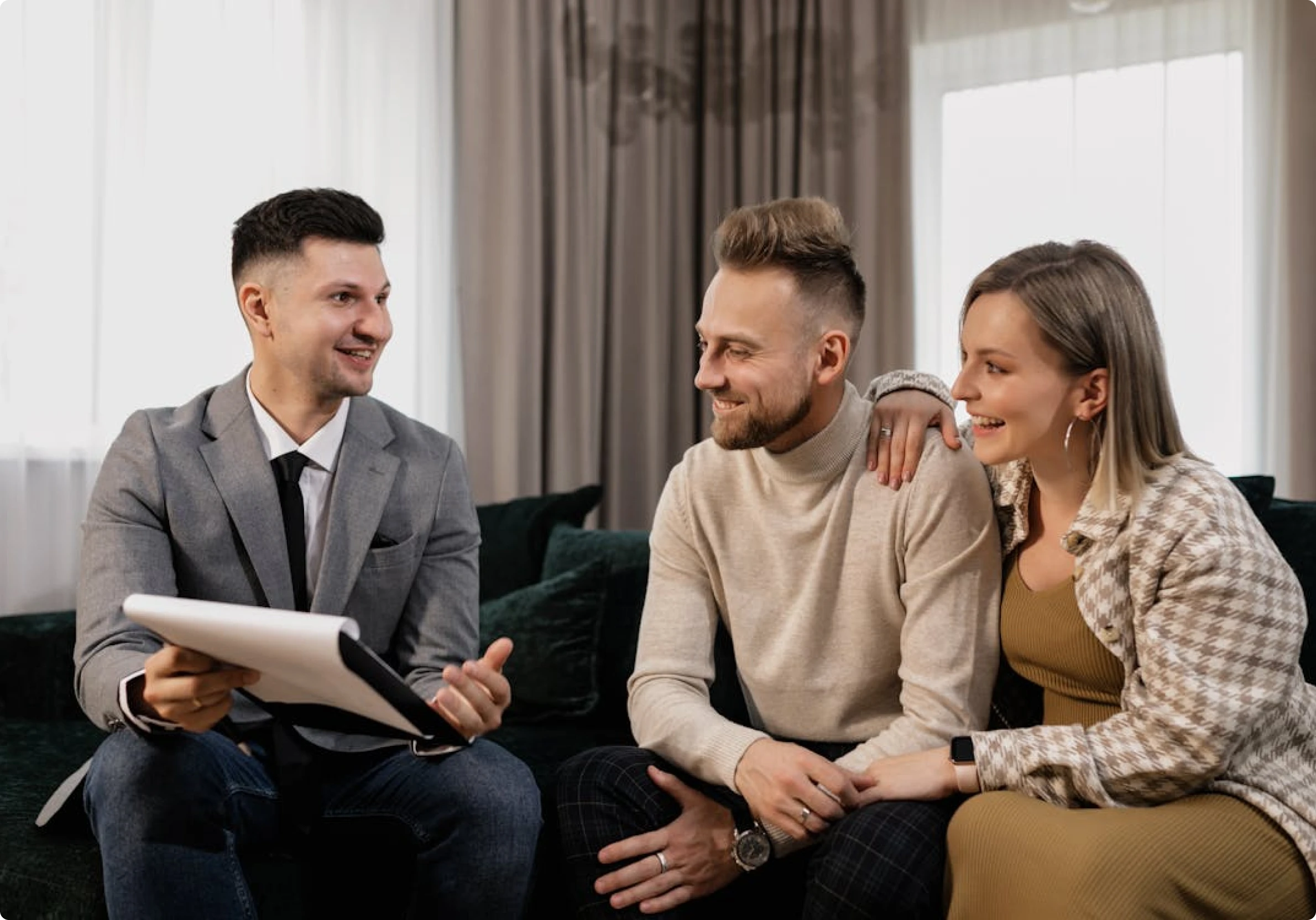 Mortgage broker from Mamba Capital Lending discussing home loan and real estate financing options with a couple seeking mortgage solutions.